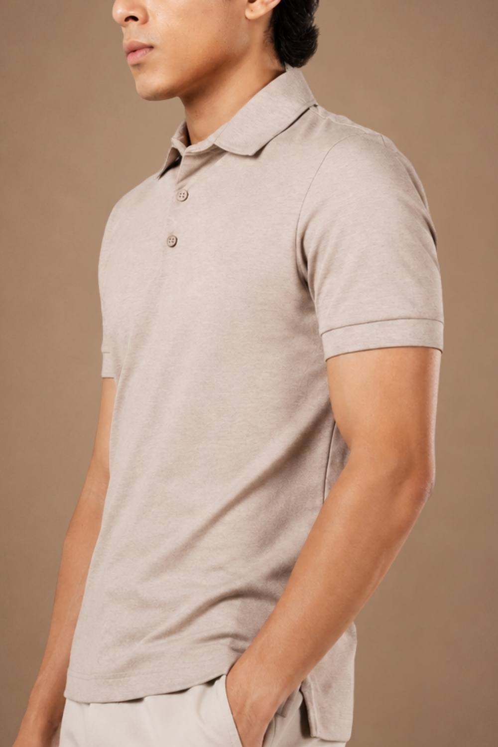 Man wearing a beige melange heavyweight Sorona polo t-shirt, front view — Oat Melange