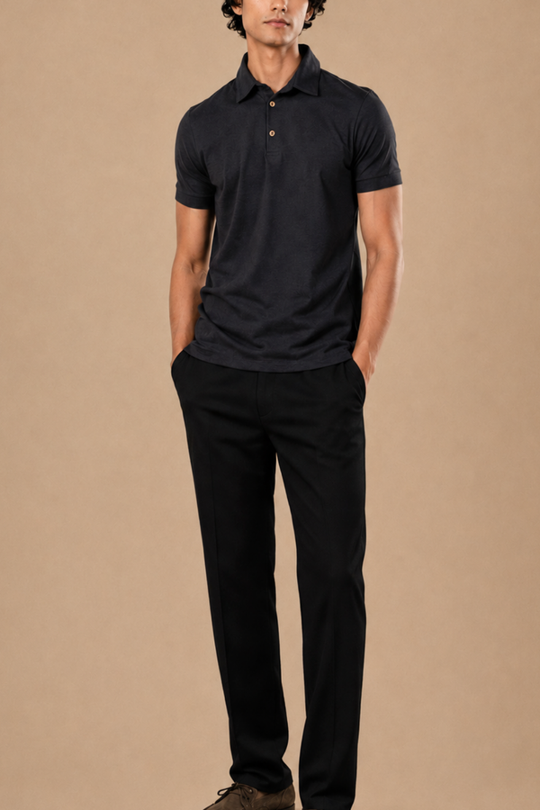 Full-length view of a charcoal grey polo t-shirt styled with black trousers